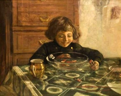 A Child Sitting At The Table